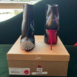 Christian Louboutin “love is a boot” red sole booties.